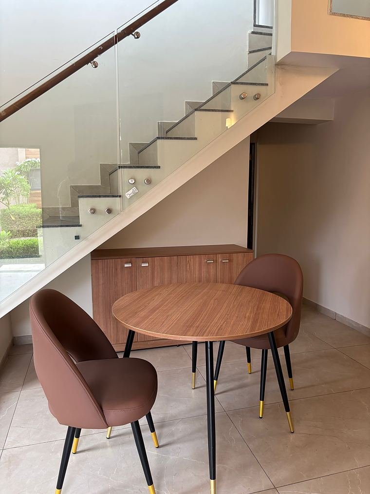 Dining corner with a low walnut sideboard tucked under the stairs - Iskon Valukad - Cottage Interiors by Bosk Furniture