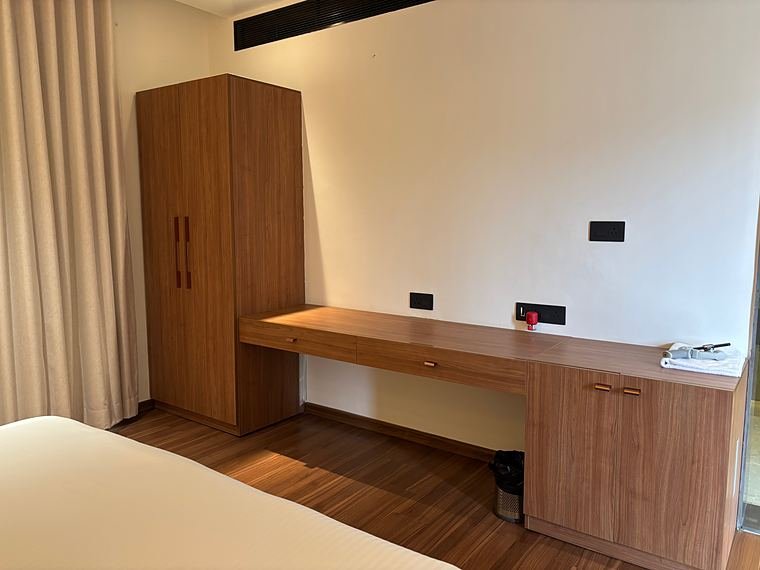 Tall wardrobe and wall-to-wall writing desk with drawers and cabinet storage - Nath Hills - Villa Suite Interiors by Bosk Furniture