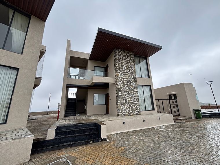 Nath Hills villa with its stone-clad feature wall - Nath Hills - Villa Suite Interiors by Bosk Furniture